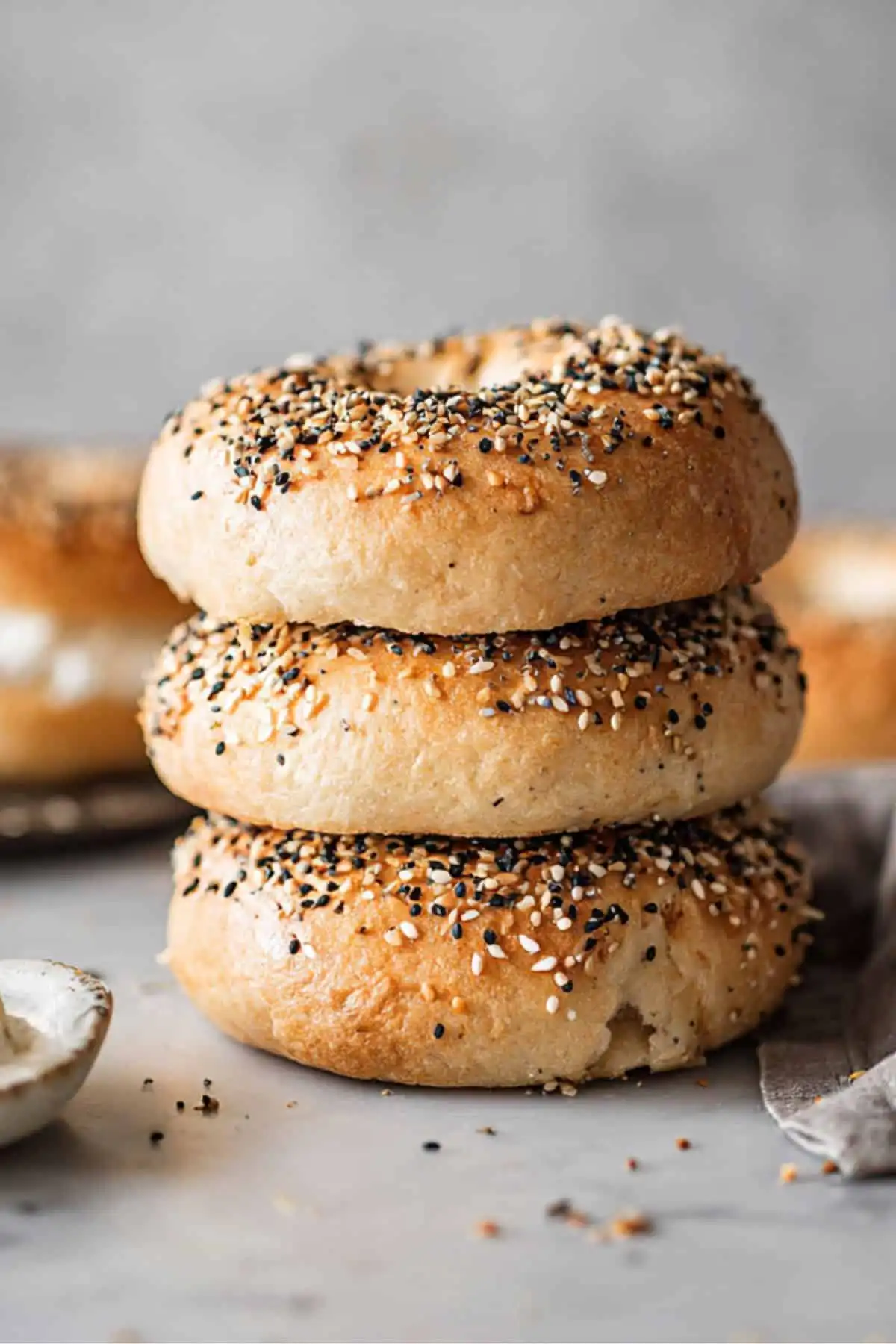stack of golden high protein bagels with seasoning