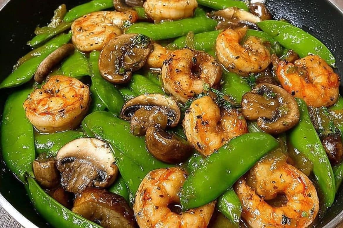 Shrimp stir-fry with snow peas and mushrooms in garlic soy sauce