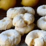 Soft Italian Lemon Cookies with glaze and powdered sugar on cooling rack