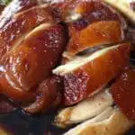 Sliced soy sauce chicken served in rich braising sauce