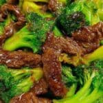 Beef and broccoli stir fry served in a bowl with savory sauce