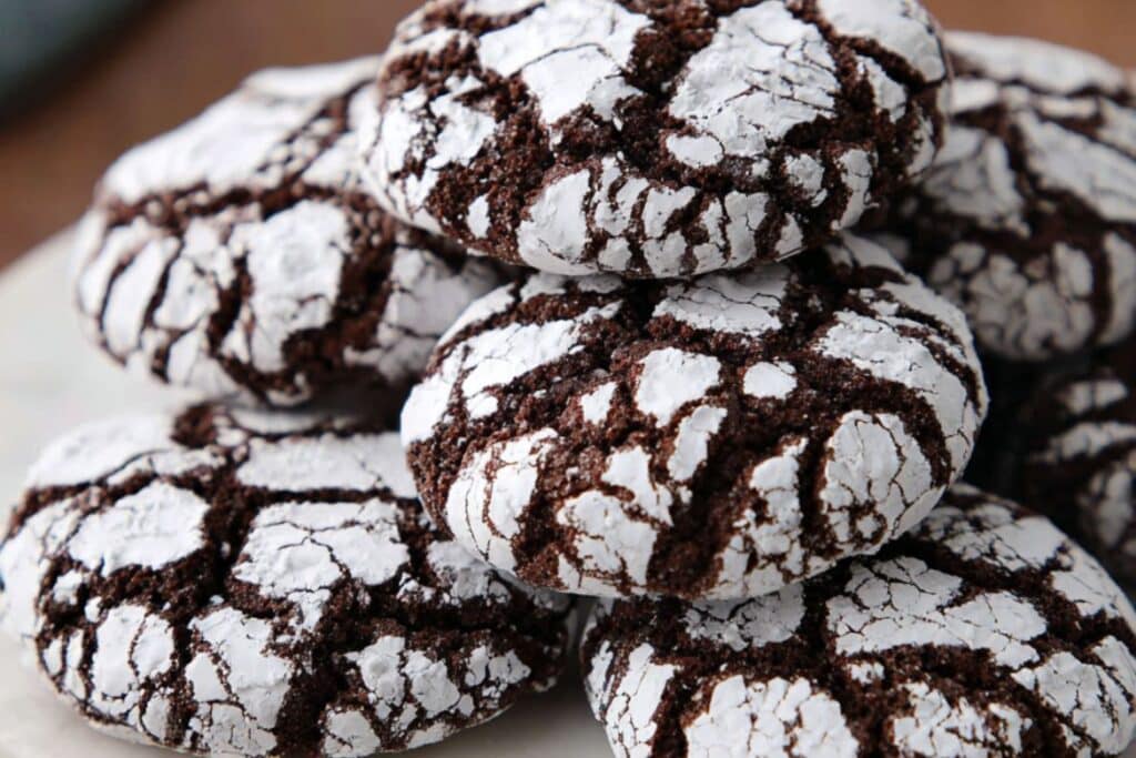 Close-up of chocolate crinkle cookies with powdered sugar cracks