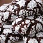 Close-up of chocolate crinkle cookies with powdered sugar cracks