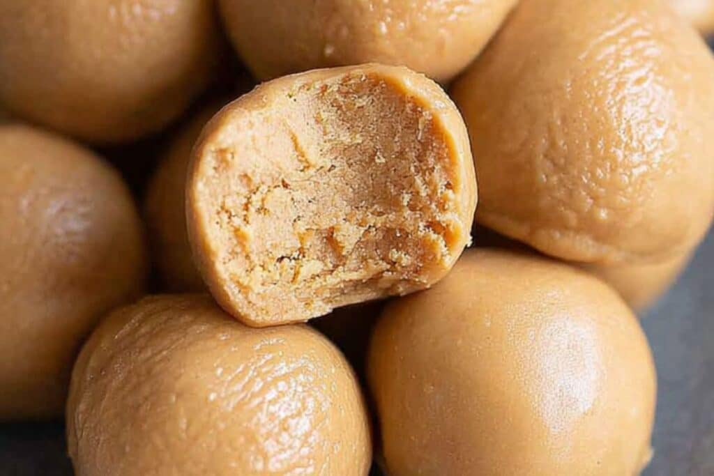 Close-up of soft 3-ingredient peanut butter balls with creamy texture