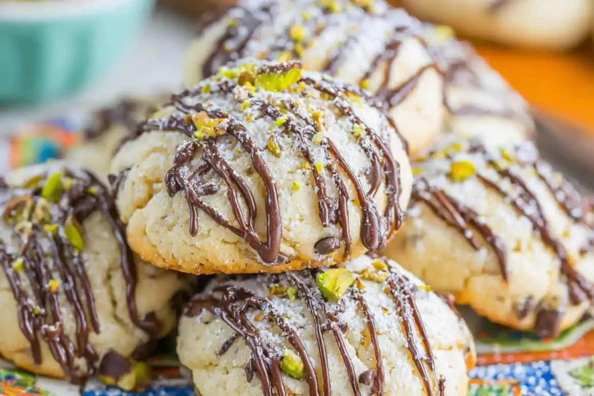 Soft Cannoli Cookies with chocolate drizzle and chopped pistachios