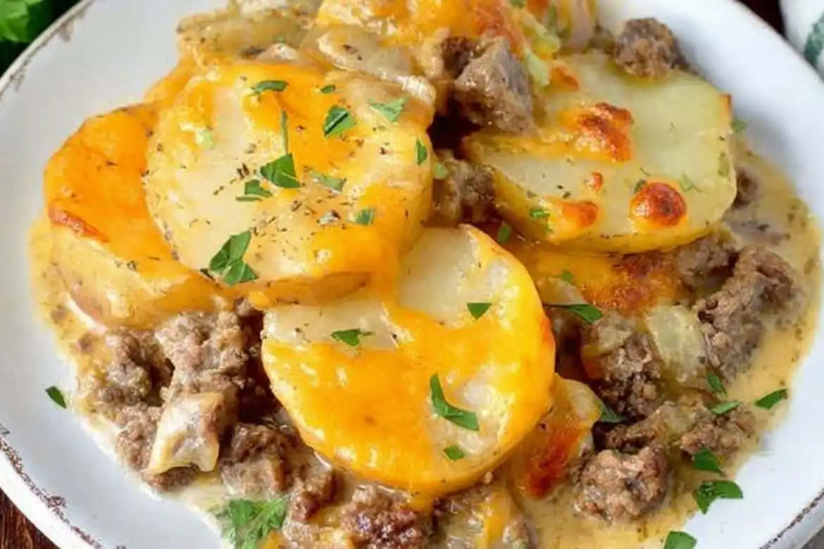 Ground beef casserole with potatoes and melted cheddar cheese