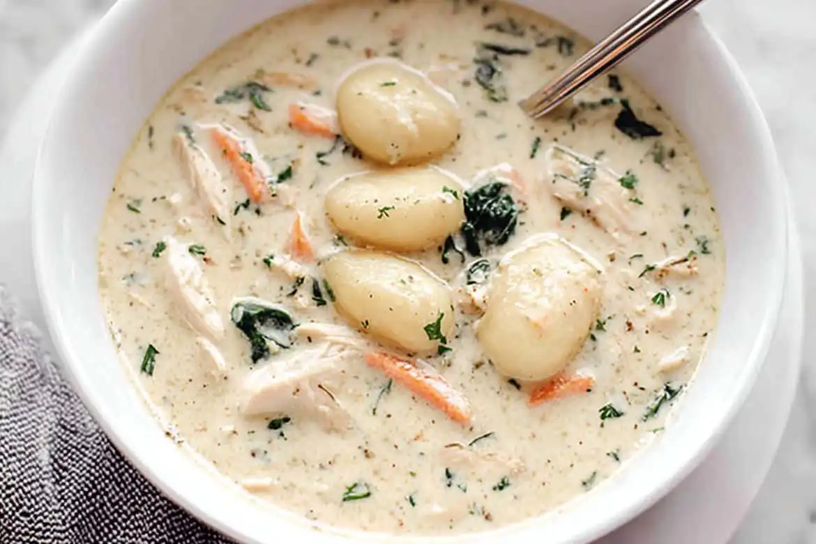 Olive Garden chicken gnocchi soup in a white bowl