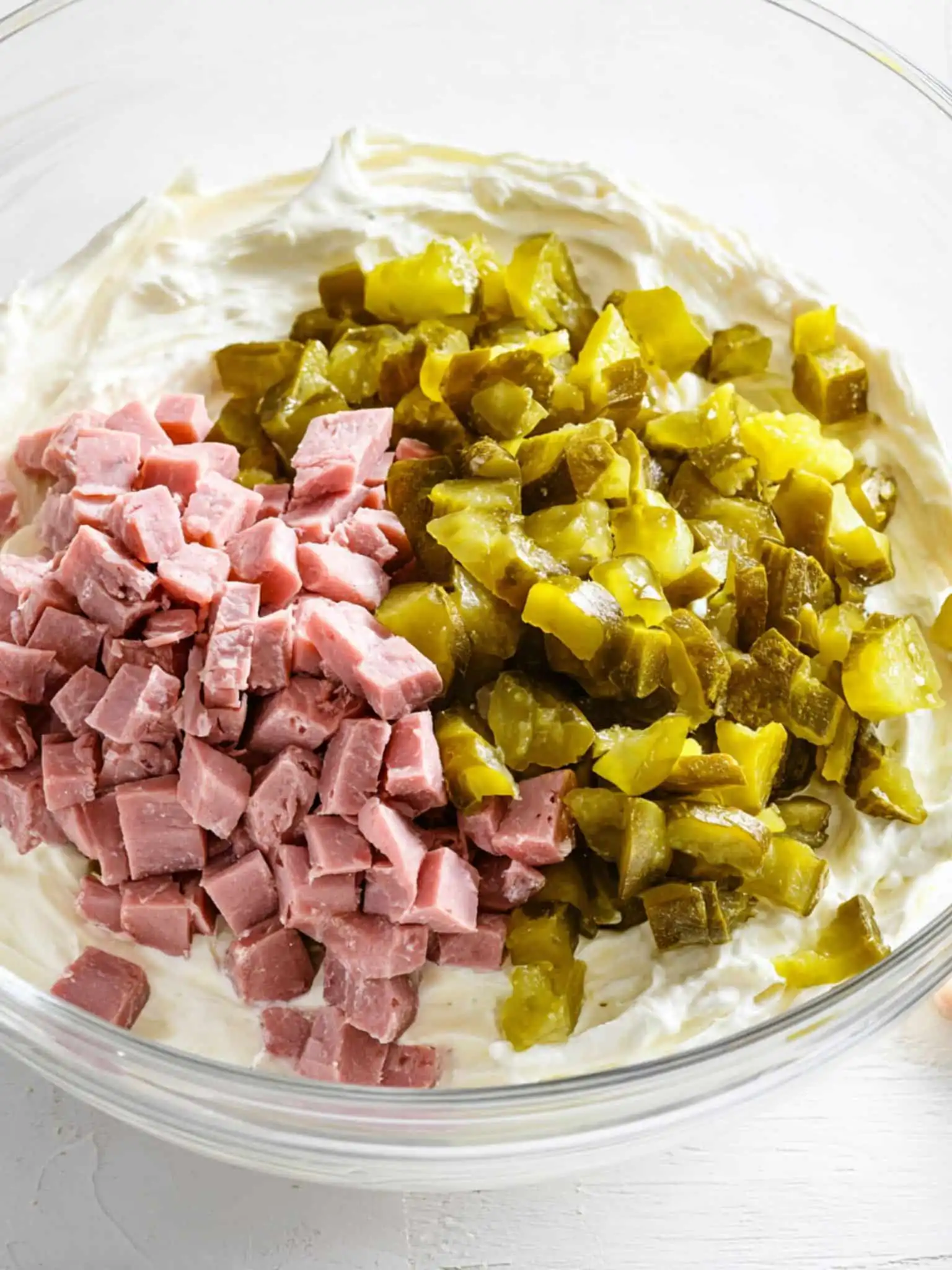 Diced ham and chopped pickles in cream cheese base for Pickle Wrap Dip
