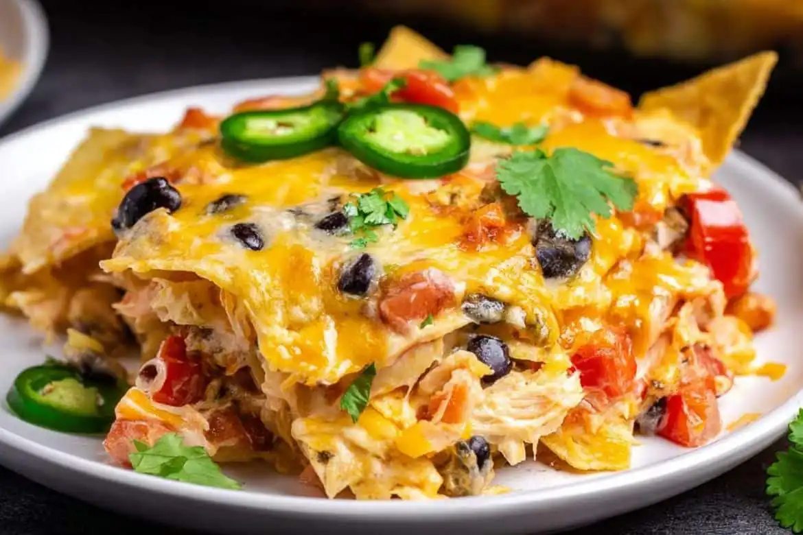 Mexican Chicken Casserole with melted cheese, black beans, and jalapeños