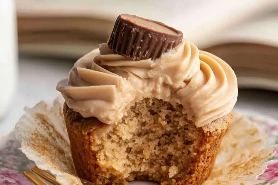 Peanut butter cupcake with frosting and peanut butter cup topping