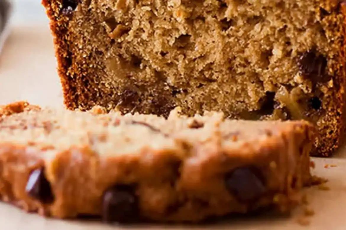 Moist peanut butter banana bread with chocolate chips, sliced and ready to serve