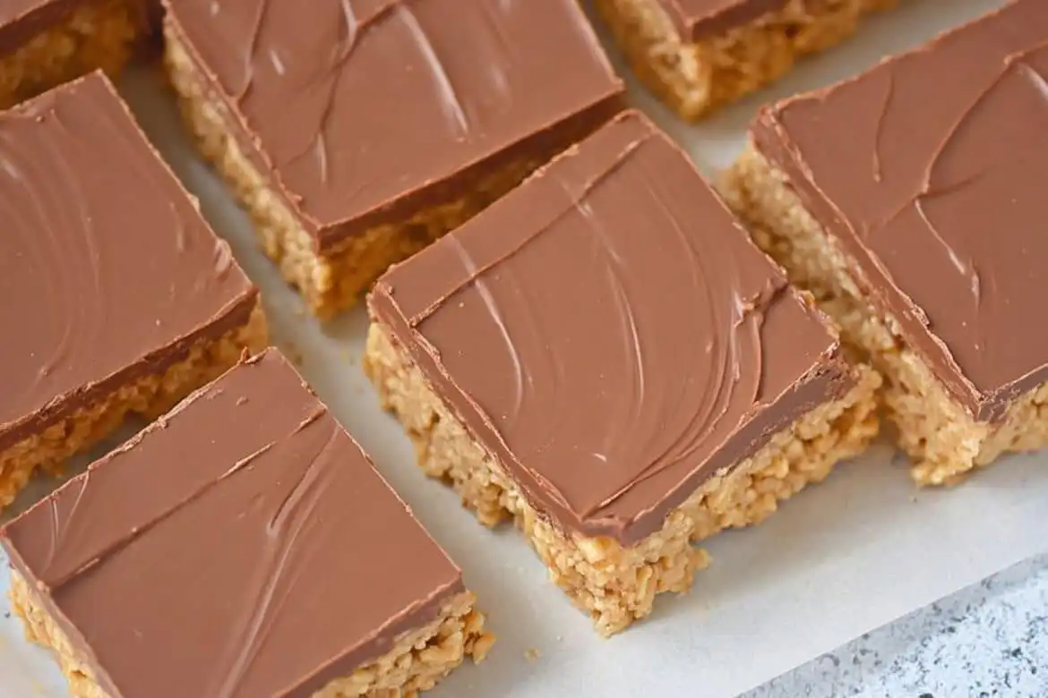 Scotcheroos recipe cut into squares with smooth chocolate butterscotch topping