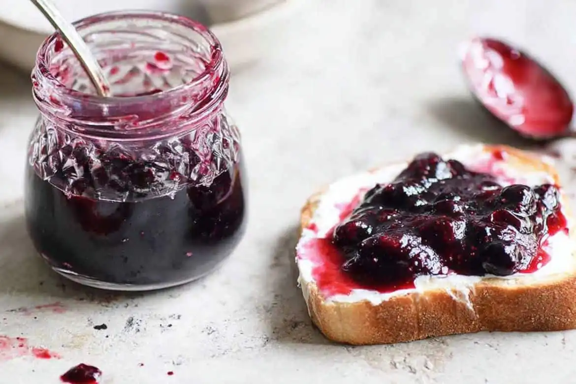 blueberry jam recipe served on toast with homemade jam in glass jar