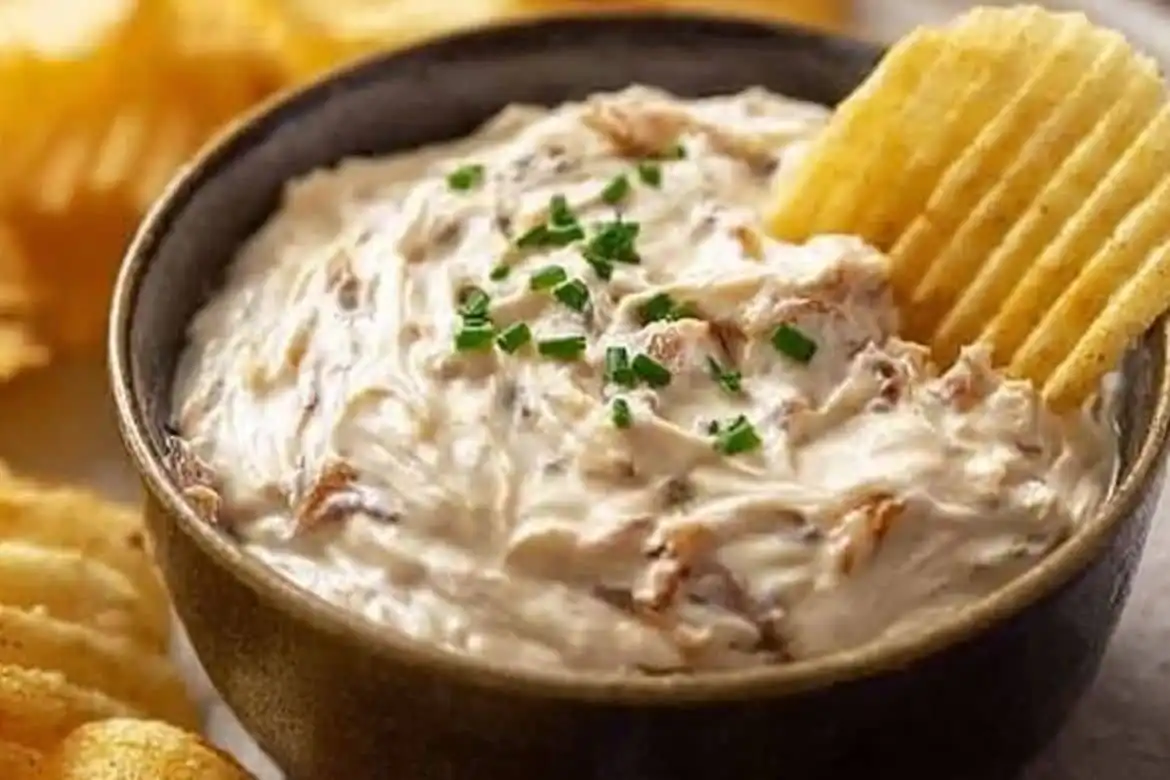 Creamy homemade french onion dip with caramelized onions and potato chips