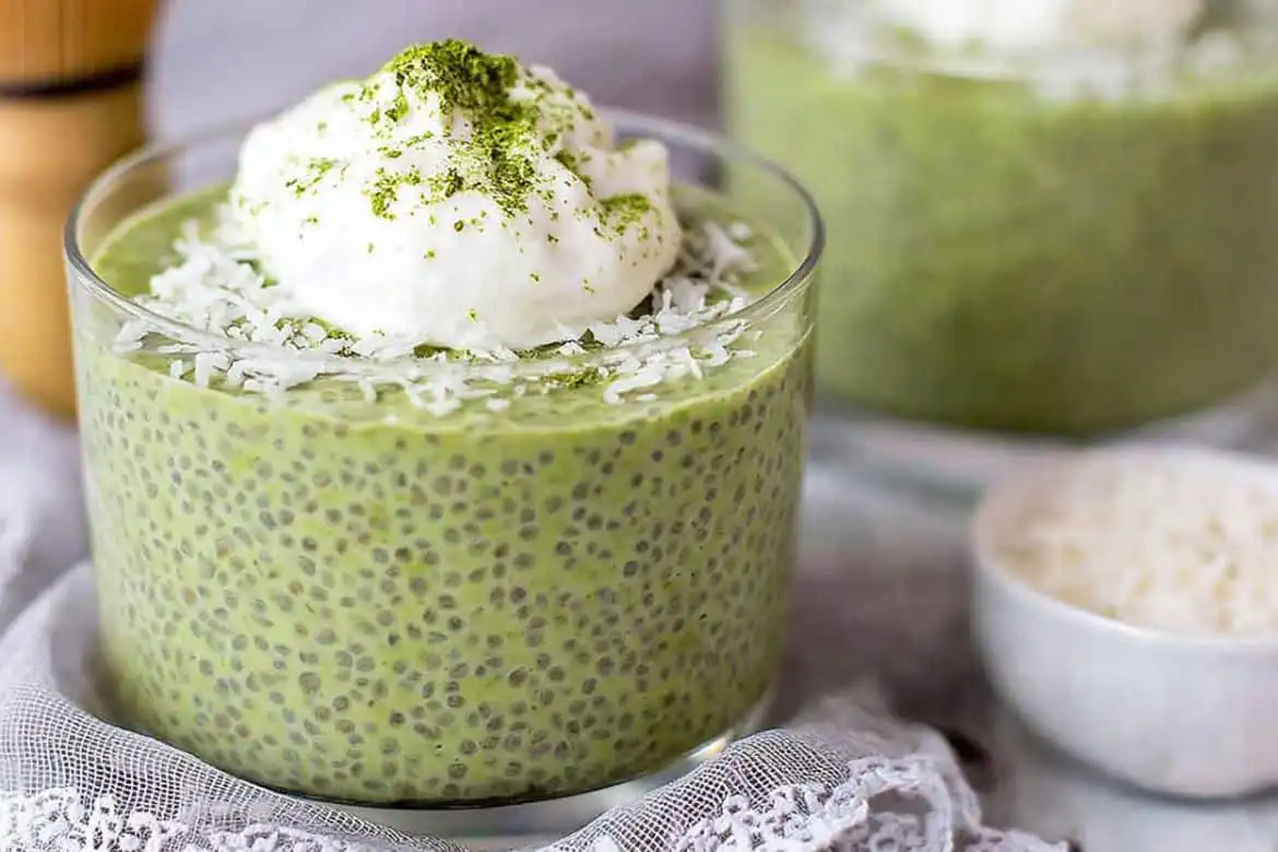 matcha chia pudding topped with coconut yogurt and shredded coconut