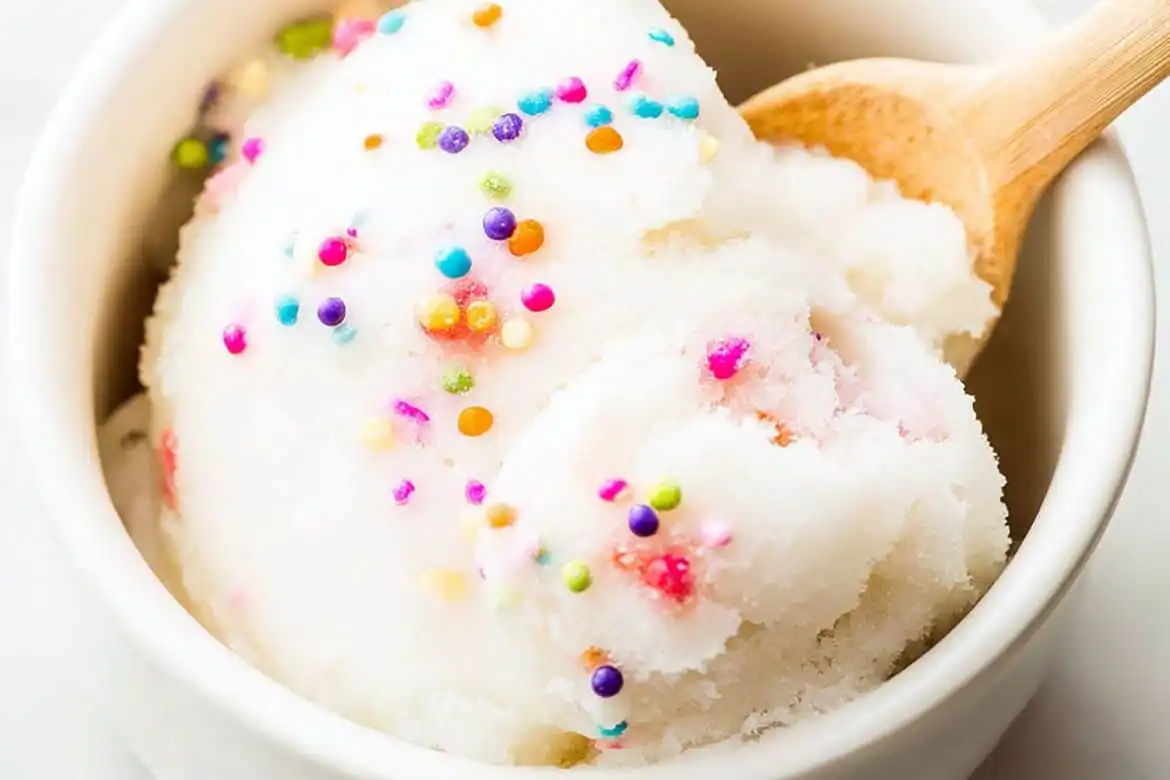 snow ice cream recipe topped with colorful sprinkles in white bowl