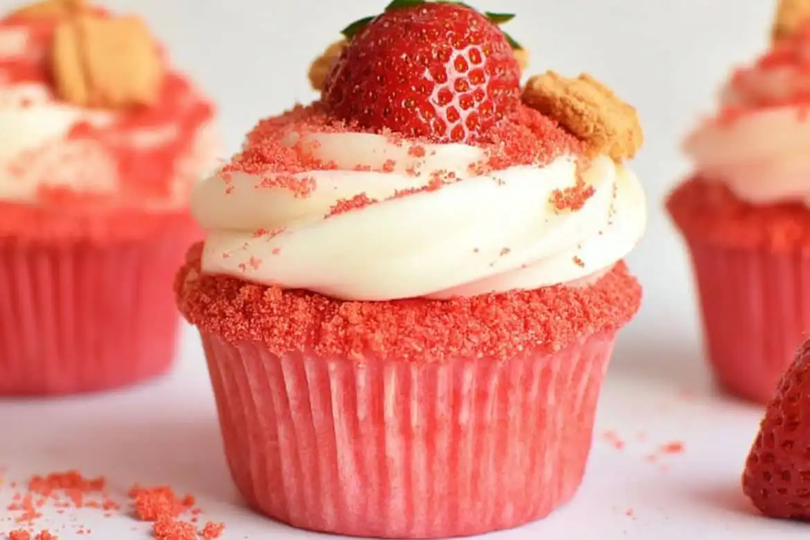 Strawberry crunch cupcakes with vanilla buttercream and fresh strawberry topping